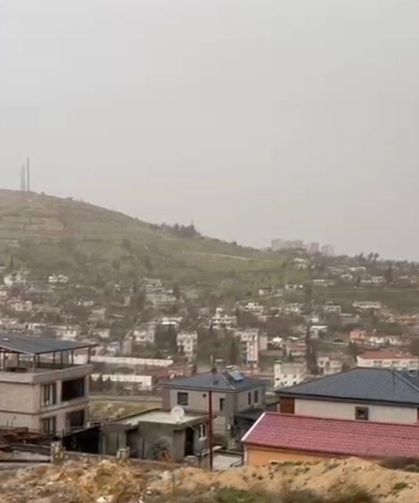 Besni'de toz taşınımı ve sağanak hayatı olumsuz etkiledi