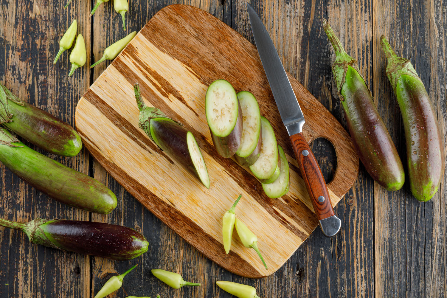 Eggplants With Slices Knife Peppers Wooden Cutting Board Flat Lay
